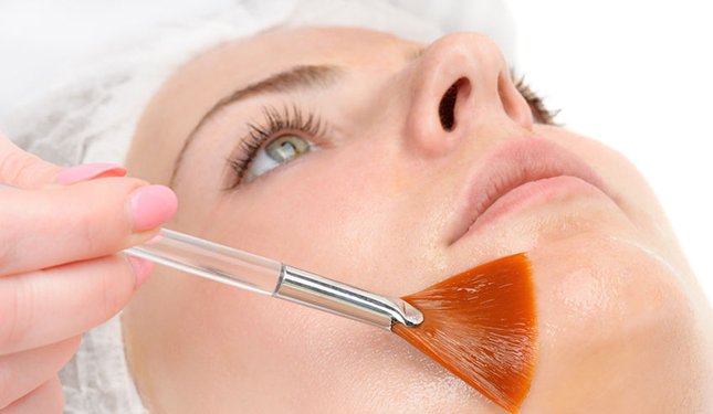 Chemical Skin Peels training course - applying a peel to a lady's face