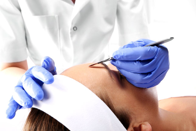 Image of woman having facial dermaplaning treatment